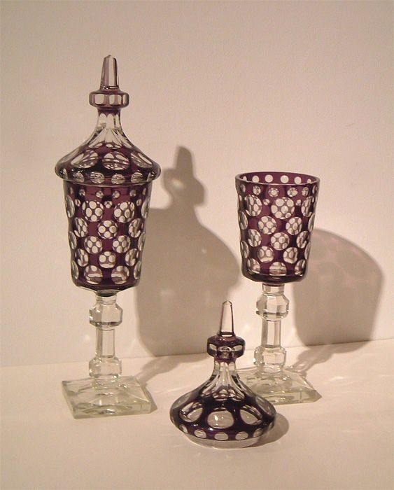 Cast and cut crystal lidded urns with purple glass overlay
Czech, c.1930


