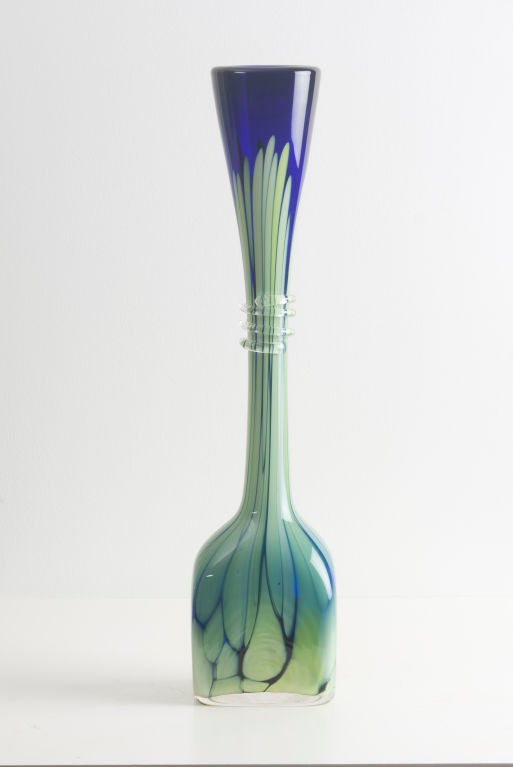 A Mid-Century Murano vase

Blown glass with colored layers and transparent thread on neck of vessel.

Italian, circa 1960

Measure: 17.5