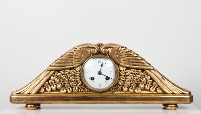 CL 22007
A carved and gilt mantle clock
By Paul Follot
France, c. 1928
18.25