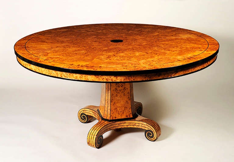 A Biedermeier inspired split pedestal extendable dining table by Andrea Zemel for ILIAD Design. Vivid burled Birch veneer with striking ebonized detailing. Above design accommodates two 20" extension leaves. table fully extends to 100".