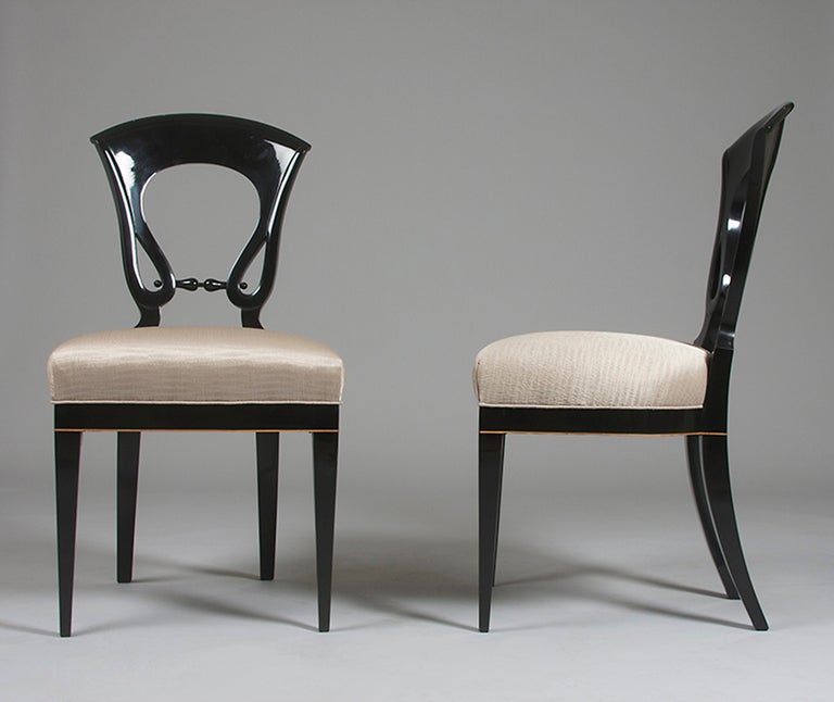 A set of four Biedermeier chairs with ebonized pearwood with maple detailing.