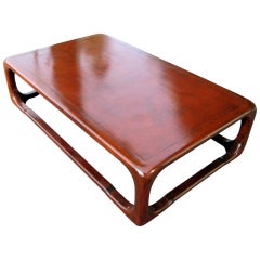 A Karl Springer Linen Wrapped Wood And Burgundy Lacquer Coffee Table