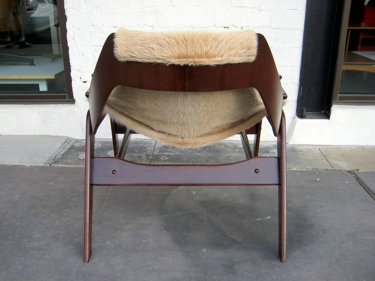 Mid-Century Modern A stained walnut sling chair designed by Jerry Johnson in 1964