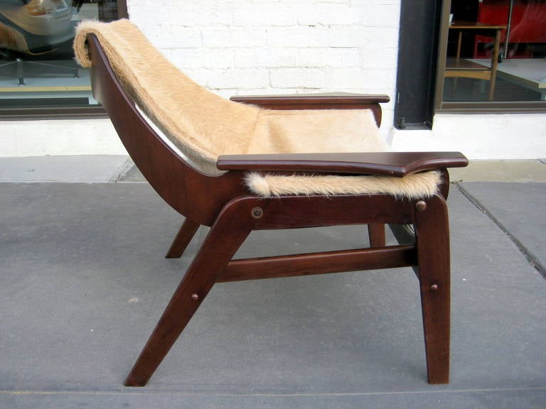 A stained walnut sling chair designed by Jerry Johnson in 1964 In Excellent Condition In Palm Springs, CA