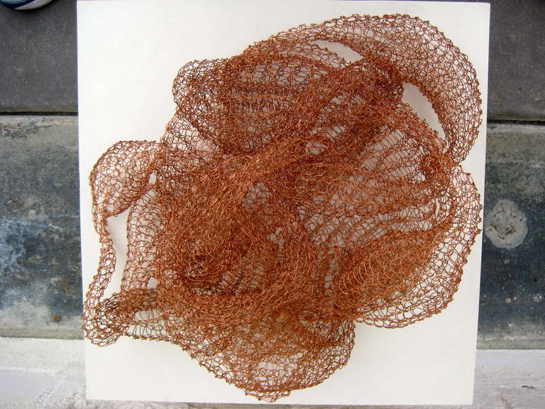 A lovely loop woven copper sculpture by D'lisa Creager 2013.
This traditional craft was popularized by Ruth Asawa beginning in the 1950's.
This piece looks beautiful resting on a surface or can be hung on the wall as well.