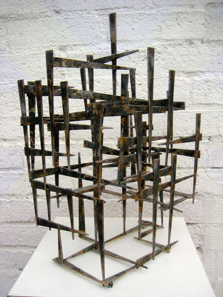 A sophisticated patinated and slightly gilded steel sculpture by American artist William Bowie. Mr. Bowie was a leading artist in the art movement that utilized welded spikes, nails and metal as well as free form constructs to create sculptures that