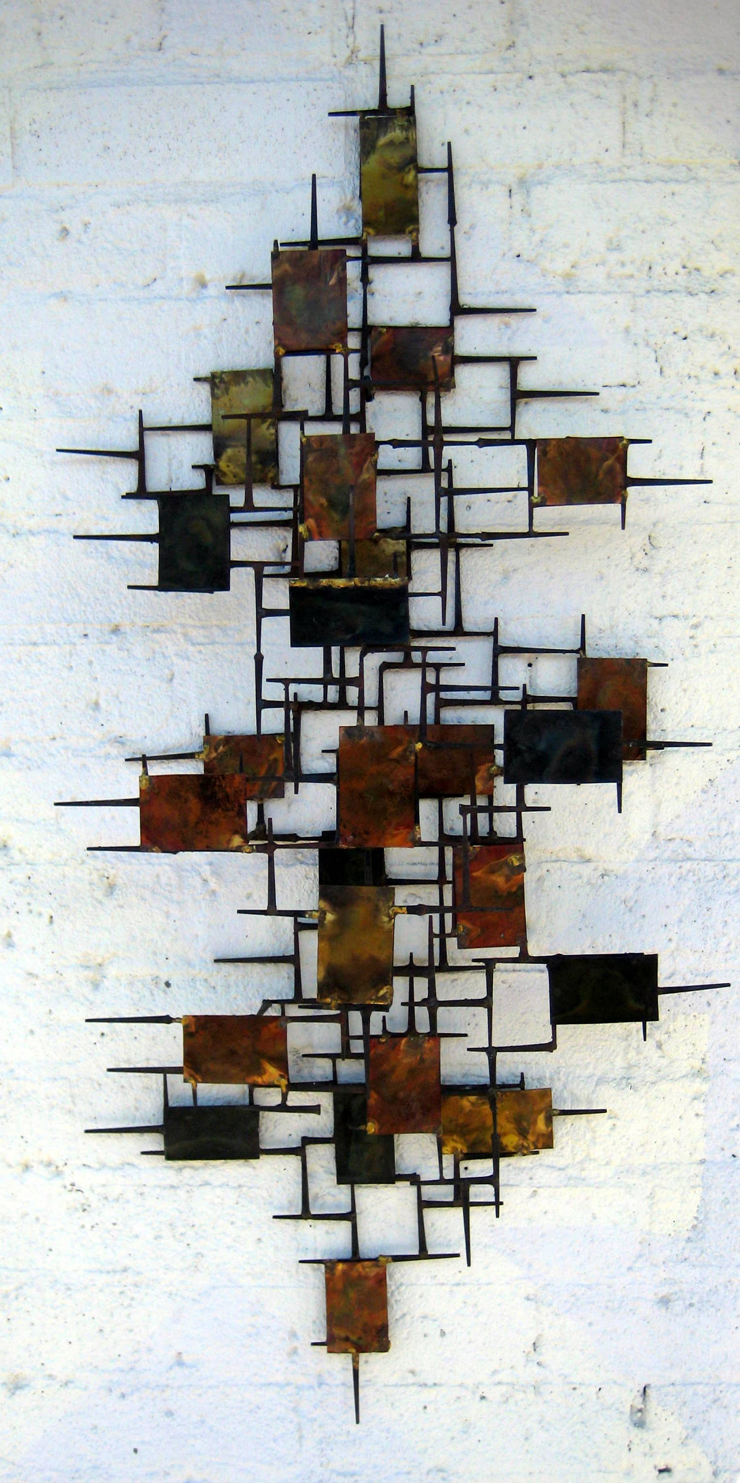 A vintage 1960's copper and steel mid century modern wall sculpture at 1stDibs