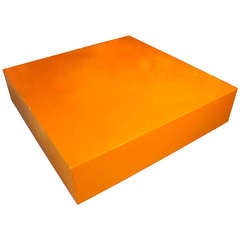A Superb Large Scale Autobody Lacquered Hermes Orange Coffee Table on a Recessed Acrylic Base