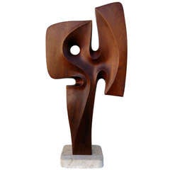 A Seductively Carved 1970's Mahogany Sculpture On Travertine Base.