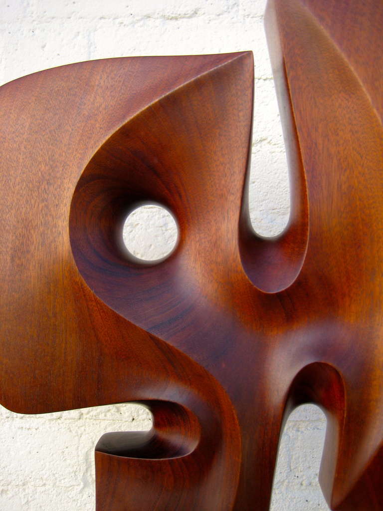 Modern A Seductively Carved 1970's Mahogany Sculpture On Travertine Base.