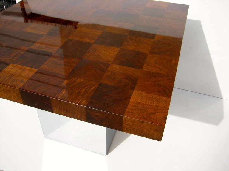 A 1970's Milo Baughman for Thayer Coggin patchwork burled walnut dining/games/center hall  table on a chrome plated steel clad base. The patchwork burl is very beautiful and the lacquer finish is original and in excellent condition.