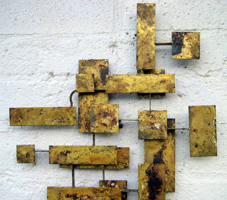 A vintage 1950's Peter Pepper Products gilded steel wall sculpture.
Peter Pepper was known for introducing sophisticated abstract art 
as part of their collection to complement the office interior furnishings lines that they produce 'til this