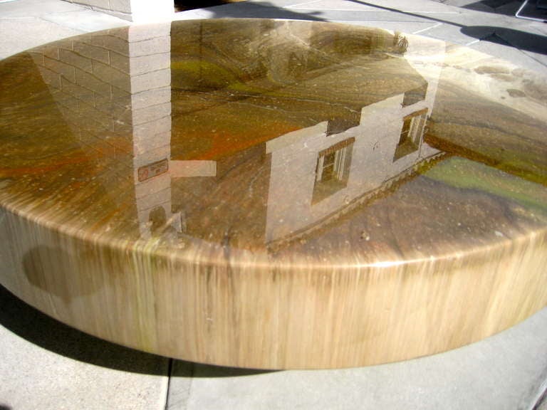 An enamel lacquered on wood floating circular coffee table on a deeply recessed chrome base c. 1970's.