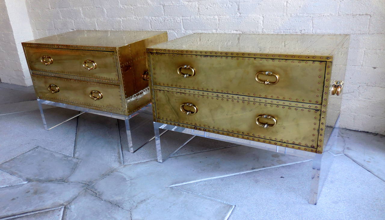 A sensational pair of two-drawer brass-clad chests made by Sarreid in the 1960s. The pair has been modernized with the addition of custom fabricated 1.25