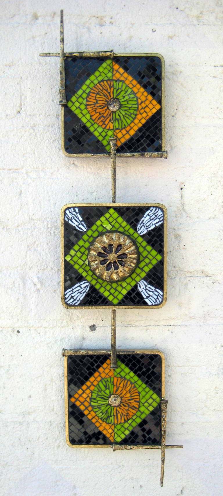 An original steel and glass mosaic wall sculpture by Del and Brenda Williams.