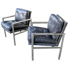 A pair of 1970's chrome and blue snake leather lounge chairs.