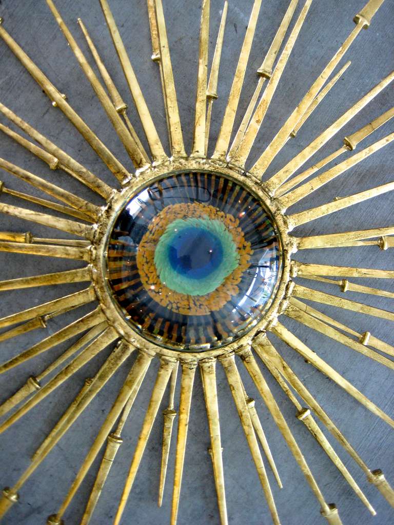 A contemporary hand welded steel and gold leaf wall sculpture with a fabulous vintage 1960's Murano glass eyeball by California artist Del Williams. Formed from hand wrought spikes that 