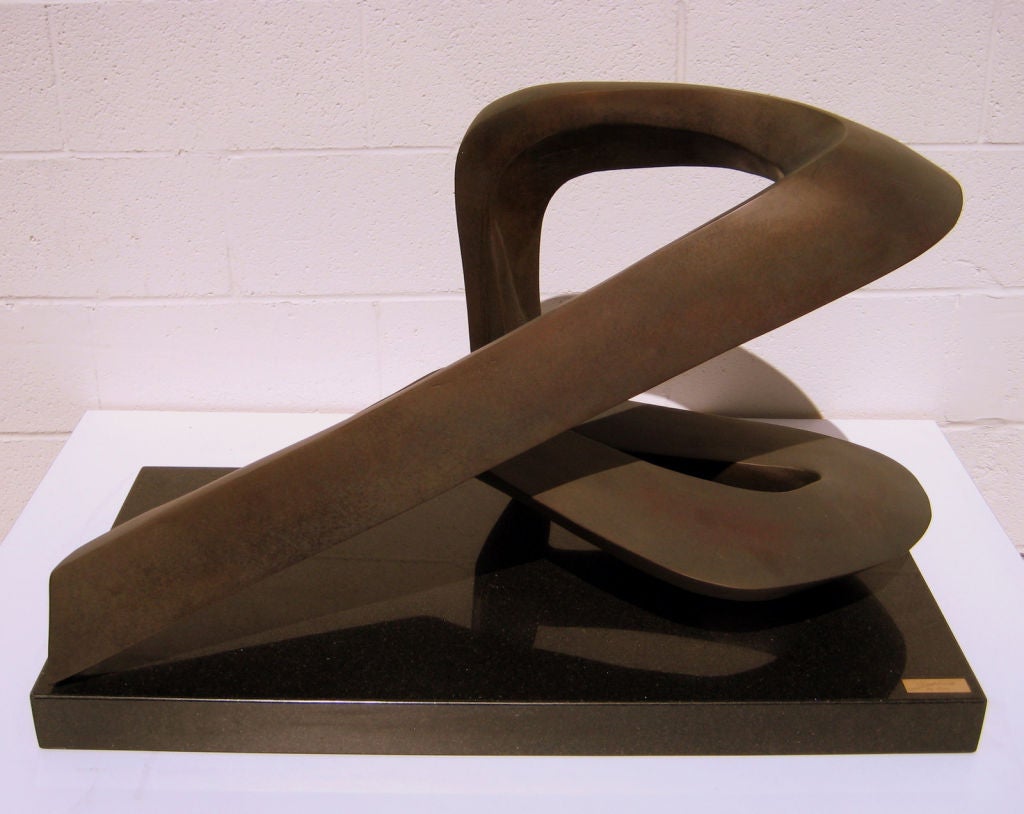 A dynamic patinated bronze sculpture titled 