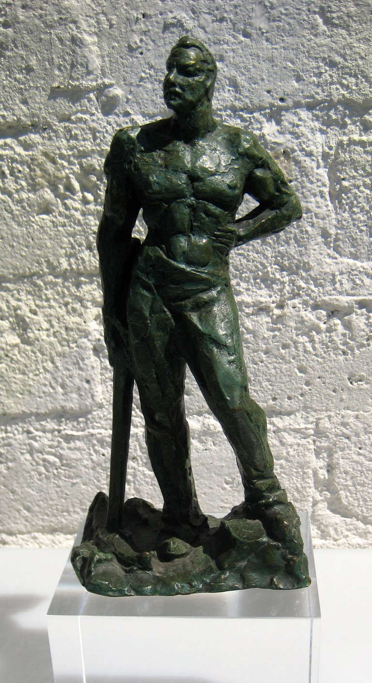 A small and heroic bronze sculpture of a miner with a pick axe by renowned Italian sculptor Alberto Bazzoni.  C. 1940's.  The sculpture is signed and stamped with the words "bronze" and "France" on the rock-work base.  The