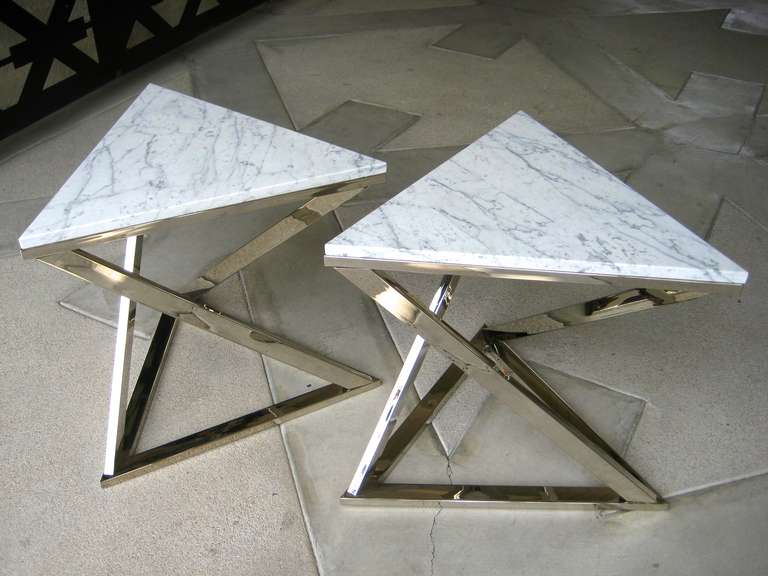 A pair of nickel plated steel triangular side tables with Carrara marble tops.  C. 1970's