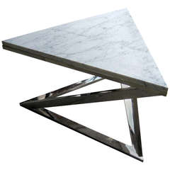 A nickel plated steel triangular cocktail table with Carrara marble Top. C. 1970's