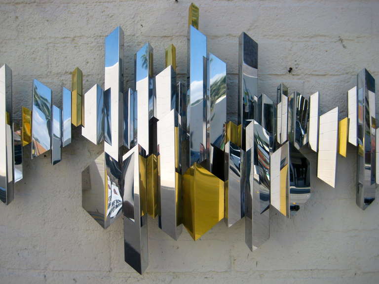 Mid-Century Modern A sparkling chrome and brass cityscape wall sculpture by C. Jere. C.1970's.