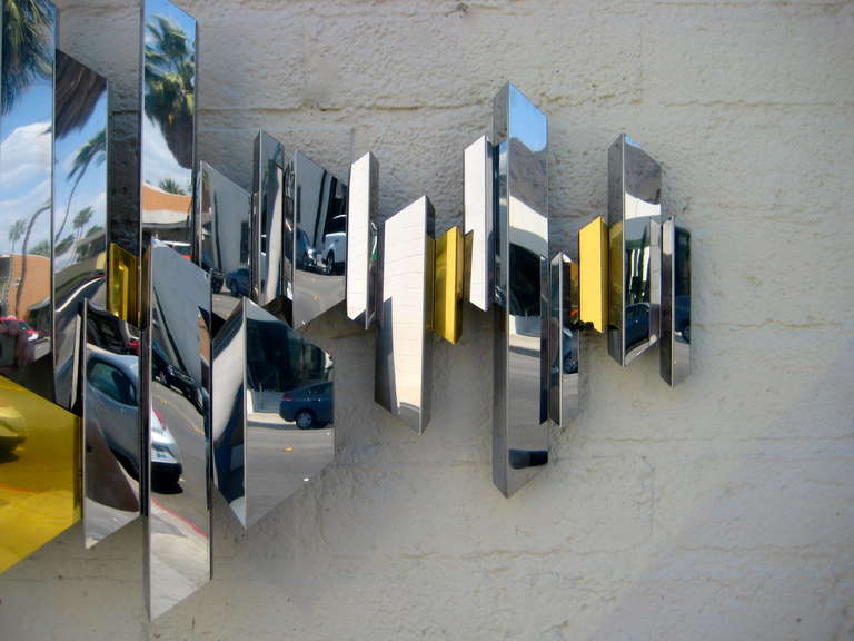 American A sparkling chrome and brass cityscape wall sculpture by C. Jere. C.1970's.
