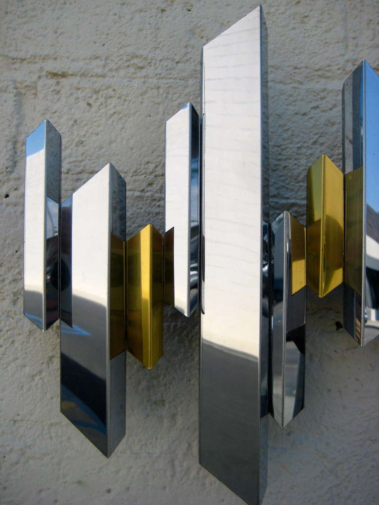 Late 20th Century A sparkling chrome and brass cityscape wall sculpture by C. Jere. C.1970's.