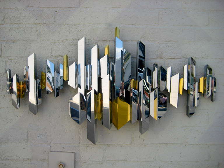 A sparkling chrome and brass cityscape wall sculpture by C. Jere. C.1970's. 3