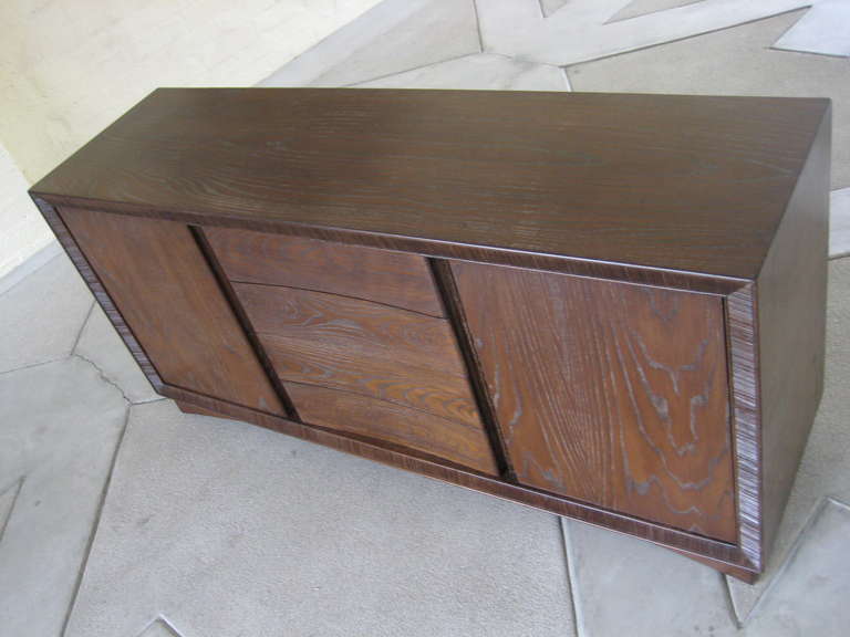 A very desireable sideboard/credenza, designed by Paul Frankl for Brown Saltman.  C. 1950.  Frankl's big innovation was his use of the Donald Deskey developed 