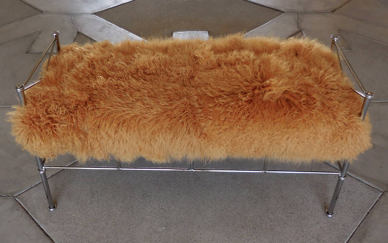 A ravishing Hollywood Regency chrome-plated steel bench upholstered in a dazzling amber colored Tibetan wool.