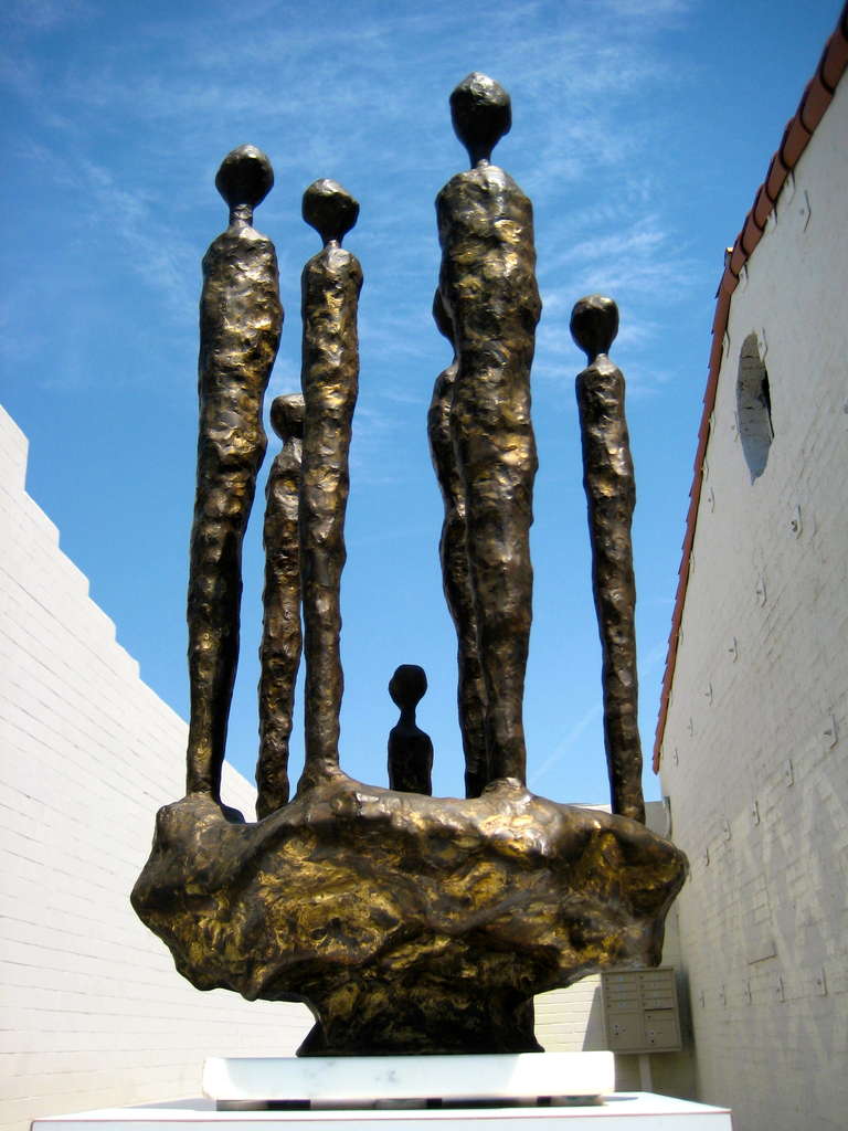 A gilt patinated bronze sculpture of 7 figures by Dale Hallberg C. 1972