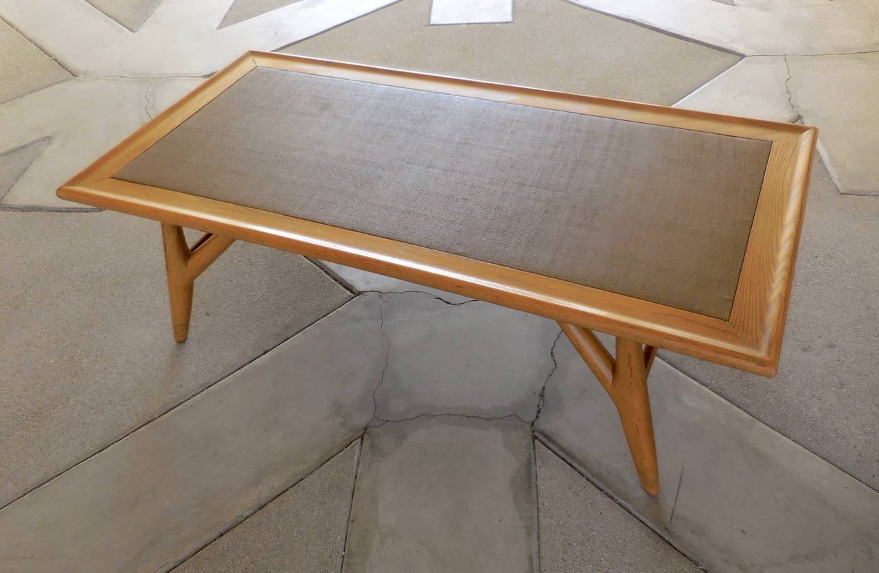 A stylish and engaging solid oak coffee table designed in the early 1950s by Jack van der Molen for the Jamestown Lounge Company.  The line of furniture was referred to as The American Casual Collection.  The design of the table pays reference to