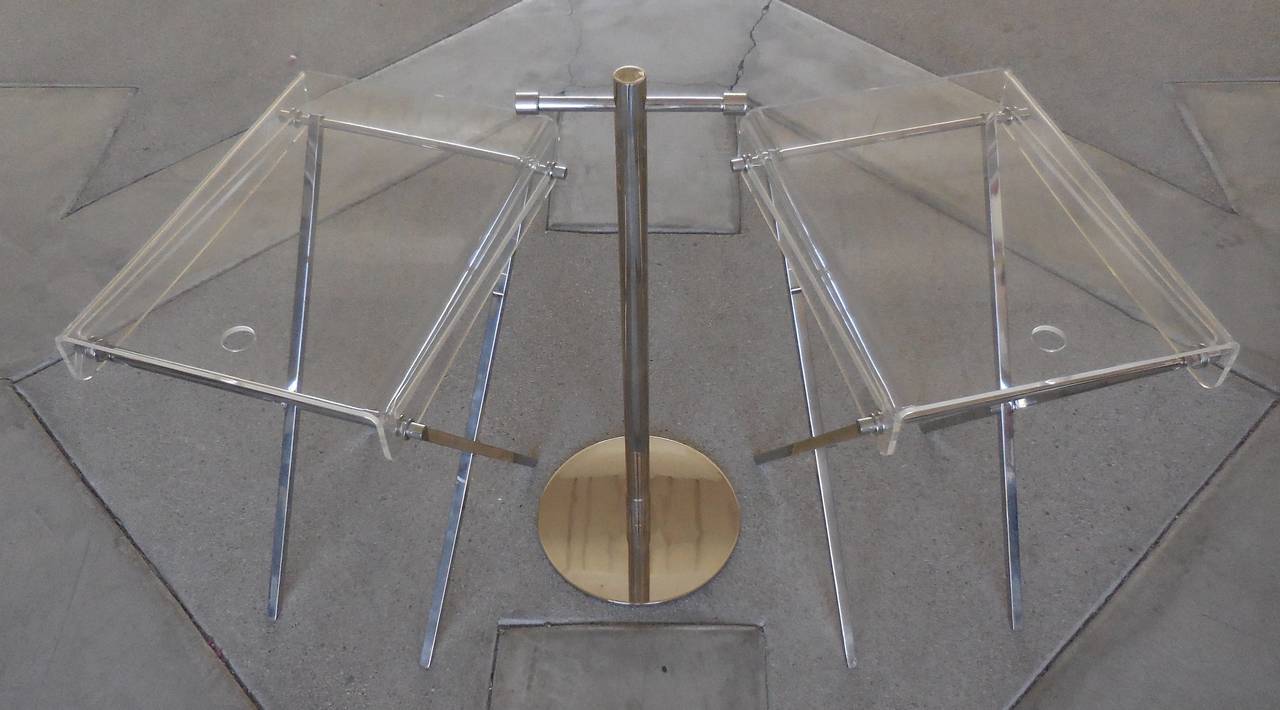 An interesting and usable set of chrome and Lucite folding tray tables and stand by Charles Hollis Jones.  Designed in the 1960's as part of the Ball Line, these sets of tray tables were extremely popular when introduced and are still in demand