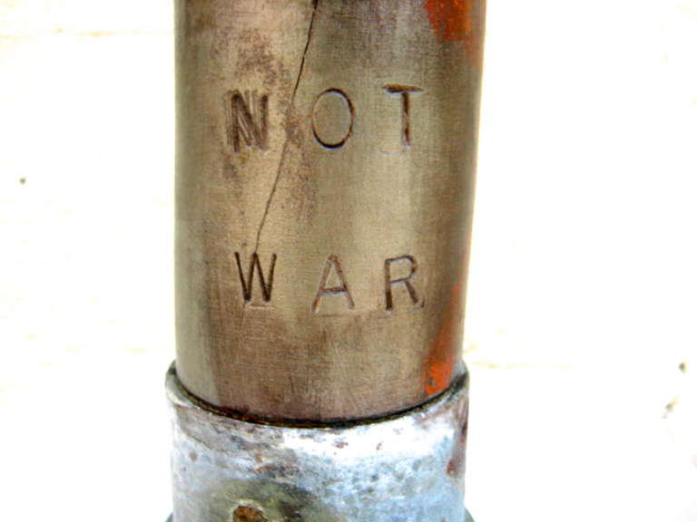 Contemporary Provocative Trio of Dummy Artillery Shells with Non-Violent Credo and Imagery
