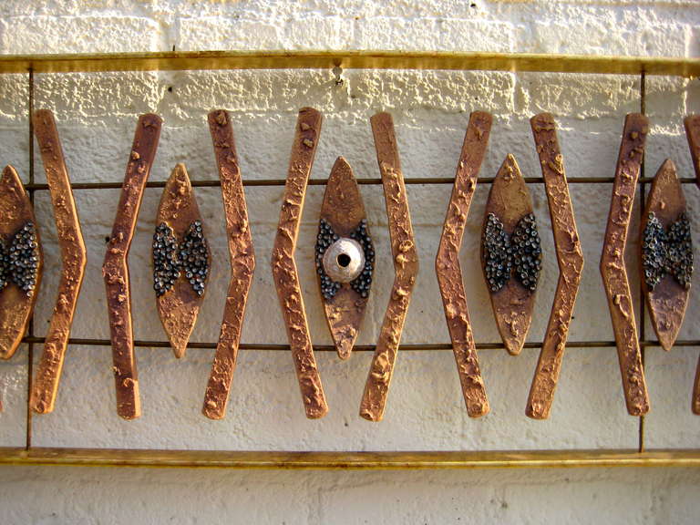 A Studio Ceramic and Gilded Steel Wall Sculpture by Brenda Williams