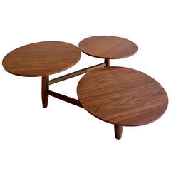 An engaging walnut coffee table with multi-level pod surfaces.  C. 1960's