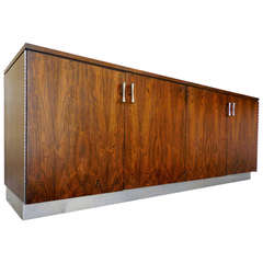 A classic four door rosewood credenza by Founders Furniture C. 1960's