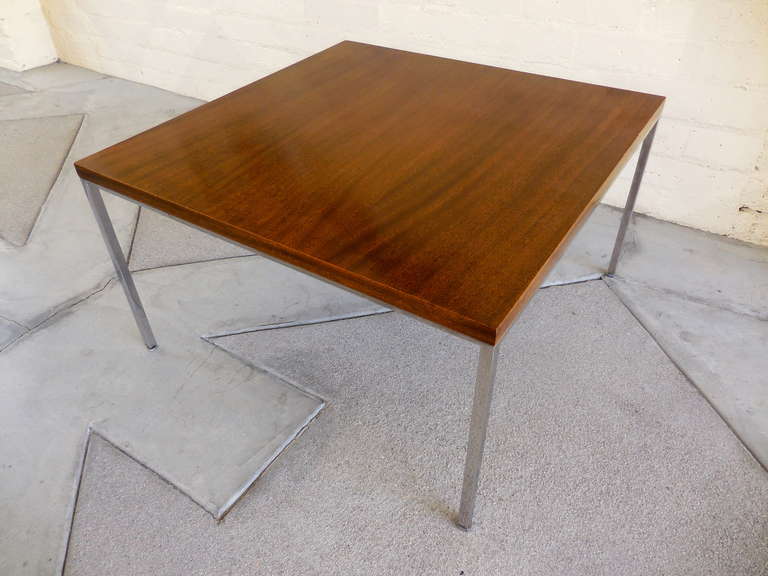 A mahogany and chromed steel square low table, designed by Harvey Probber in the 1950's.  This table was part of a suite of furniture from a 1950's home in Wisconsin and was original to the residence.  It was used as an end table and located next to
