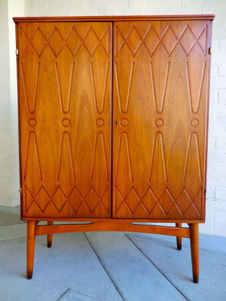 Mid-Century Modern A graphically patterned Swedish mahogany cabinet on legs.  C. 1960's