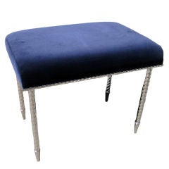 An upholstered nickel plated bench/stool by Charles Hollis Jones