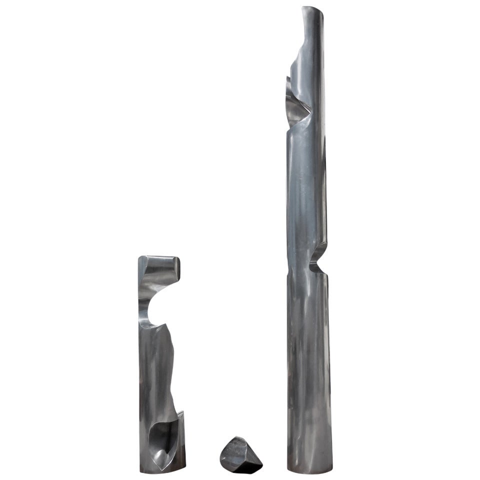 "Two Columns With Wedge" a stainless steel sculpture by Willi Gutmann.  C. 1971.