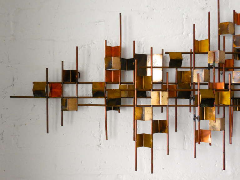 A large vintage strikingly modernist mixed metal wall sculpture by William Bowie C. 1960's. This composition includes some classic modernist touches that echo designs of that era like the iconic folded roof by Donald Wexler in the now landmark Steel