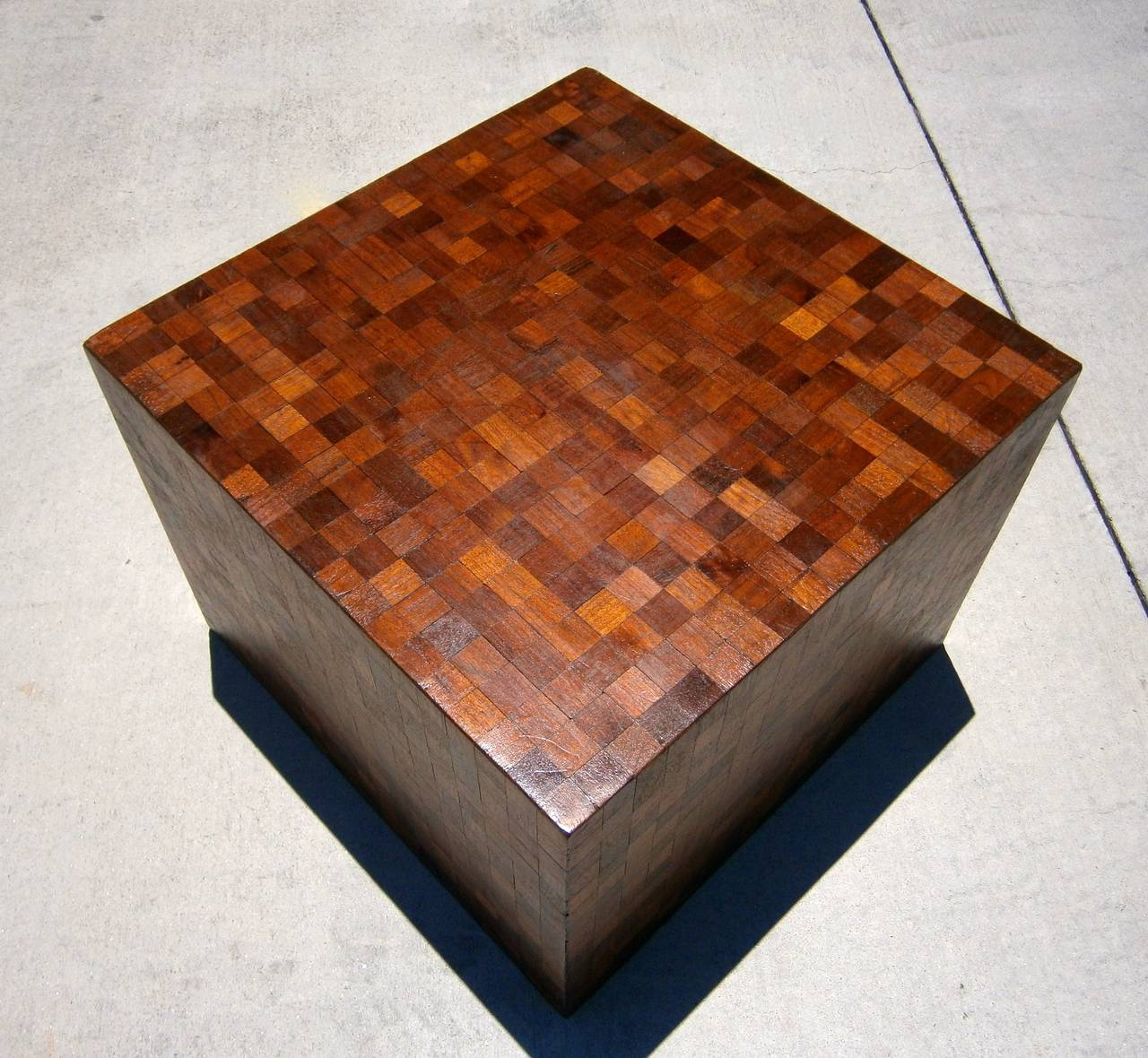 This hand-made cube table is covered with hundreds of individual squares of .25