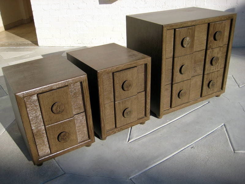 A small chest of drawers and two bedside cabinets made by <br />
