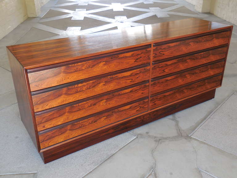 A long chest of drawers manufactured by the Norwegian company Westnofa in the 1970s.  The chest was fabricated using choice cuts of Brazilian rosewood across all surfaces of the piece, including the back. The veneer used for the drawer fronts is
