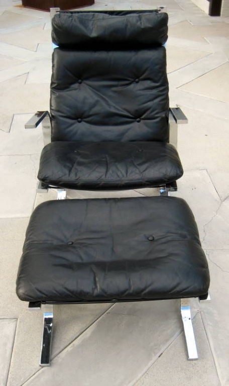 A  club chair and ottoman