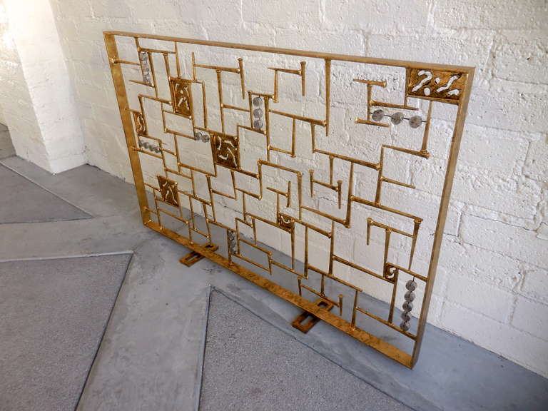 A spectacular modernist hand-sculpted gold leafed steel fire screen by American artist Del Williams. This screen is also available in custom sizes to fit your fireplace opening. Please contact us directly for details of placing a custom order.