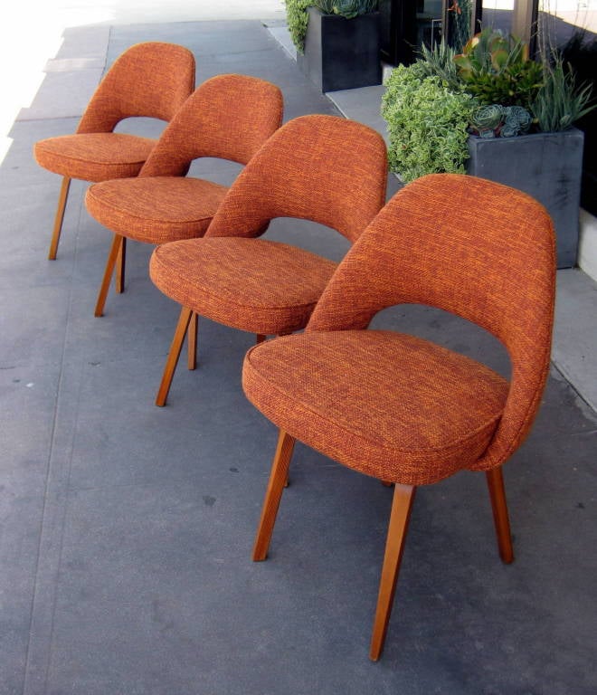 A set of four Executive side chairs with laminated wooden legs designed by Eero Saarinen for Knoll.
C.1960's. Newly reupholstered in a vintage inspired fabric.