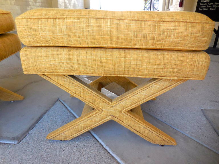 A pair of vintage 1970s X-form upholstered benches made by American of Martinsville. This pair has just been newly reupholstered in a woven cotton or poly blend Mid-Century style fabric.
